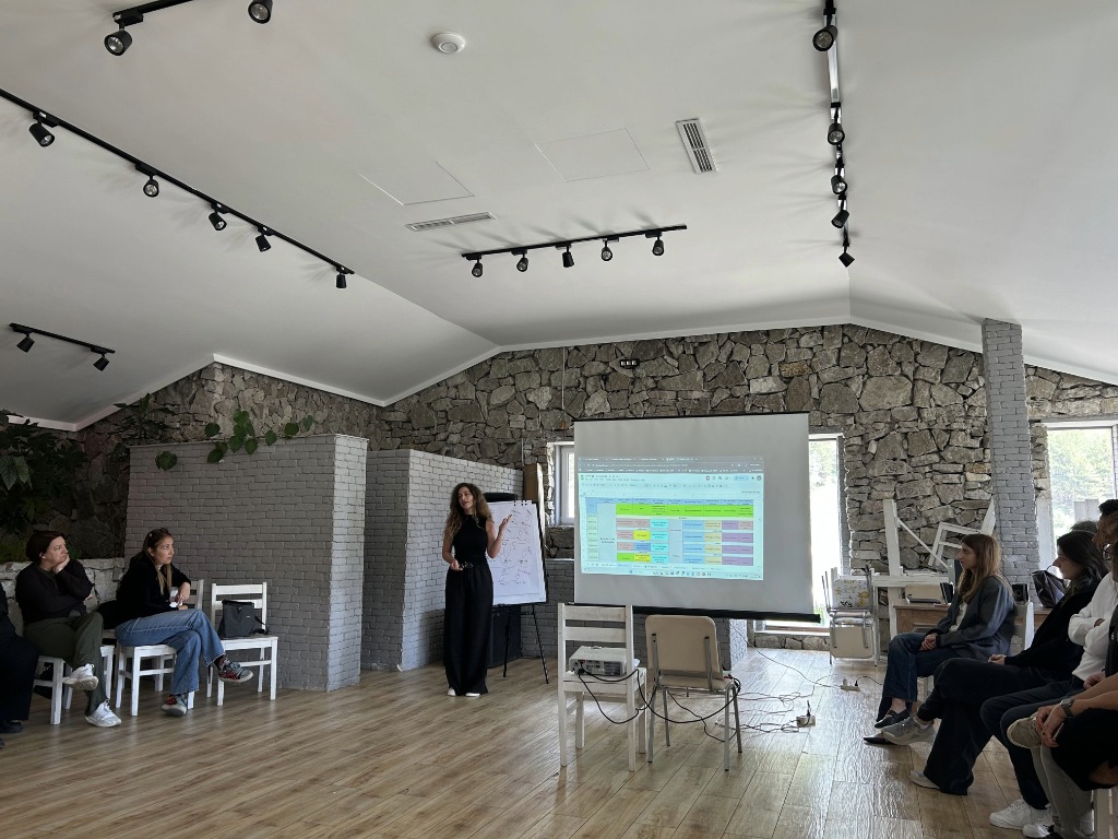 Presenter showing project schedule
